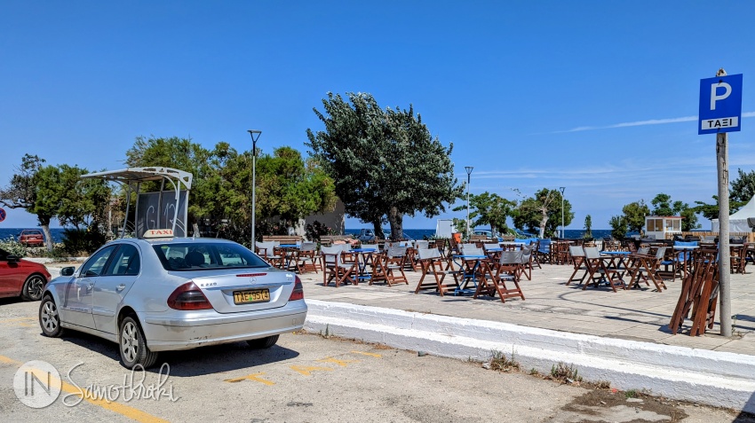The taxi station is in Kamariotissa, across from the small lighthouse.