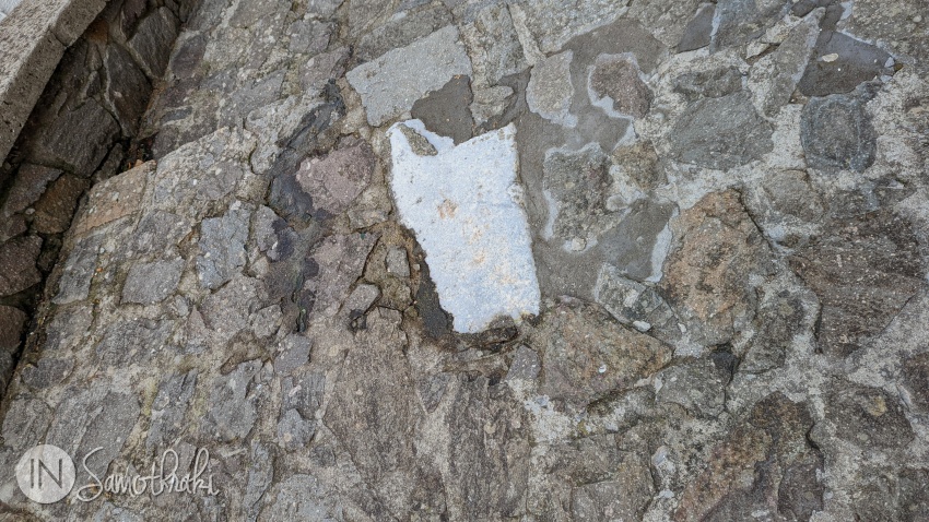 A piece of marble in the pavement of Chora