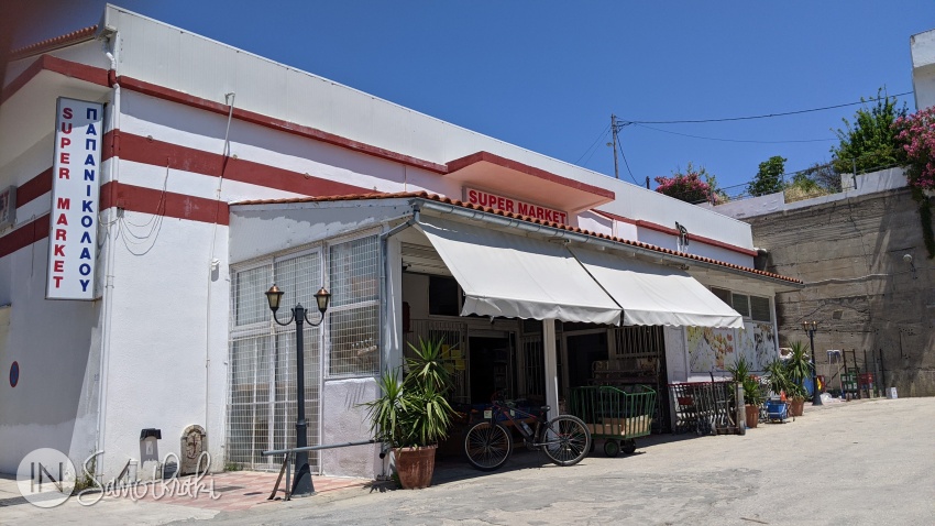 The Papanikolau supermarket is on a parallel street.