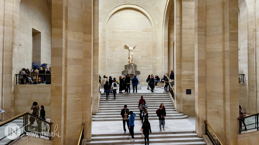 The statue of Nike of Samothrace is still displayed today at the Louvre, above the Daru Staircase.